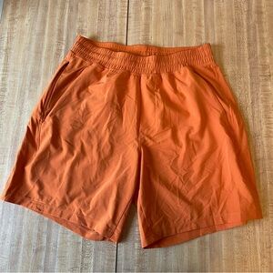 LULULEMON Mens Pace Breaker Linerless Shorts 7" Rush Orange Small